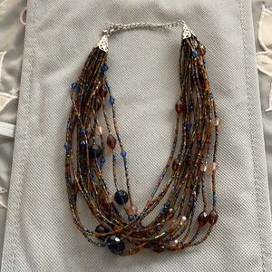 Beaded multi strand necklace, with lobster claw clasp.